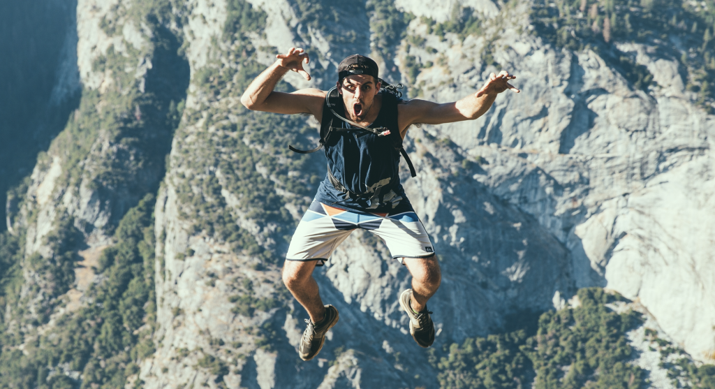 Man jumping off cliff